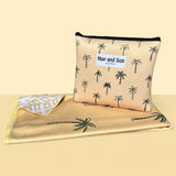 Napandsun Sunset Palms sand free beach towel. Double sided design, front: Medium size palm trees on a yellow/goldish background. Back: White background yellow geometric lines. free wetbag included.