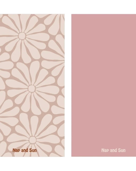 Nap and Sun Nude background towel with light nude hippy-style flower pattern, solid pink color on the back, eco-friendly, quick-dry, and compact design