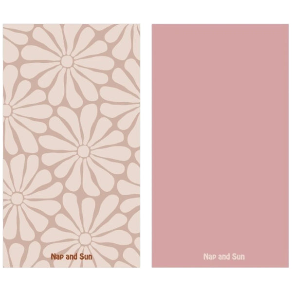 Nap and Sun Nude background towel with light nude hippy-style flower pattern, solid pink color on the back, eco-friendly, quick-dry, and compact design