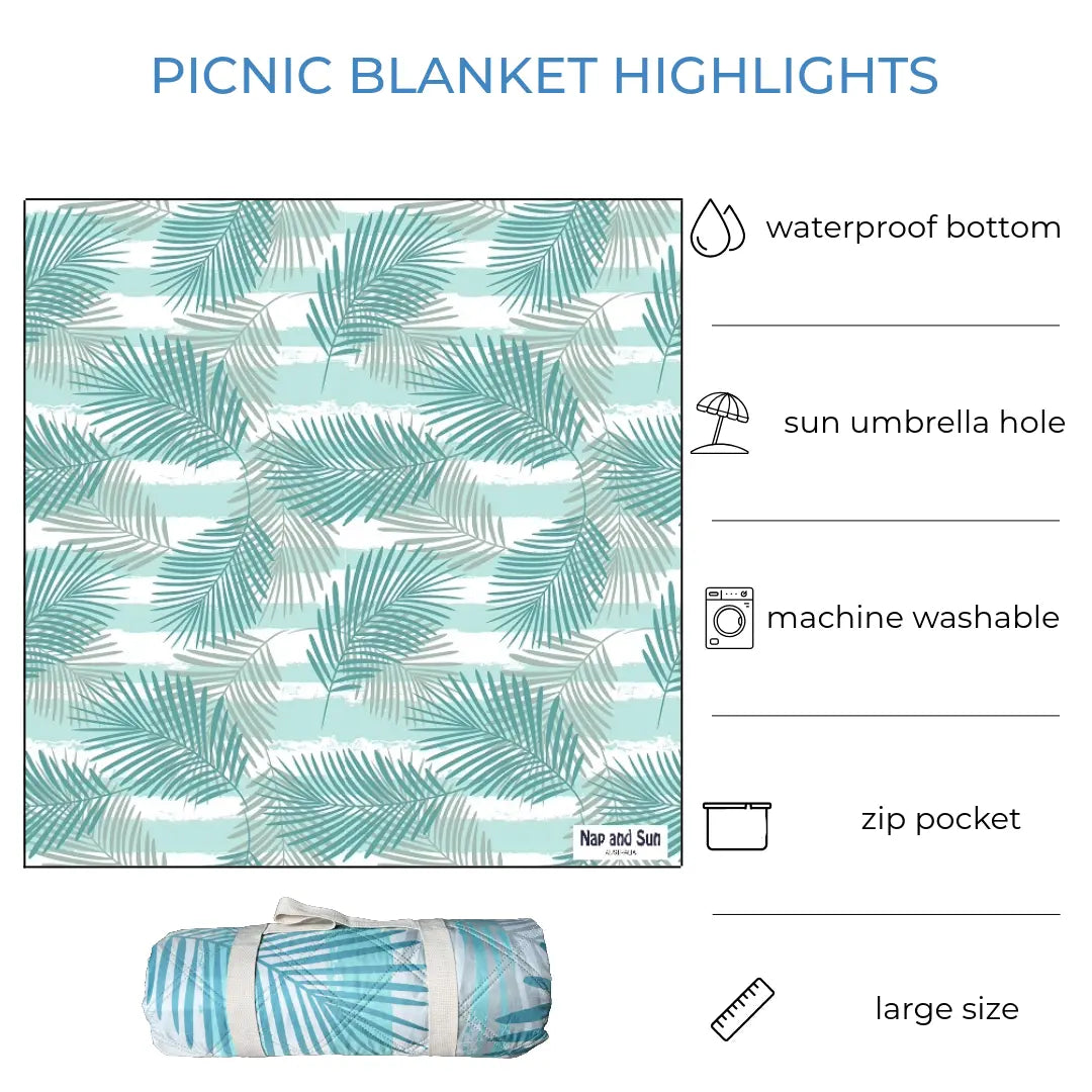 Light green palm leaves patterned picnic blanket displayed fully stretched out and rolled up. Text overlay highlights features: waterproof bottom, sun umbrella hole, machine washable, zip pocket, large size.