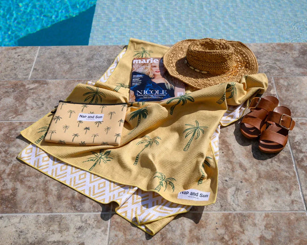 Yellow beacch towel near the pool