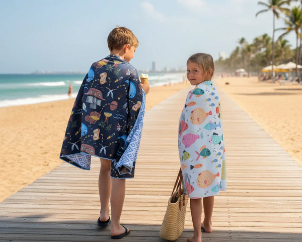 Kids walking on beach covered in cute towels
