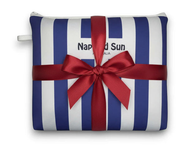 blue white striped beach pouch wrapped in a red ribbon