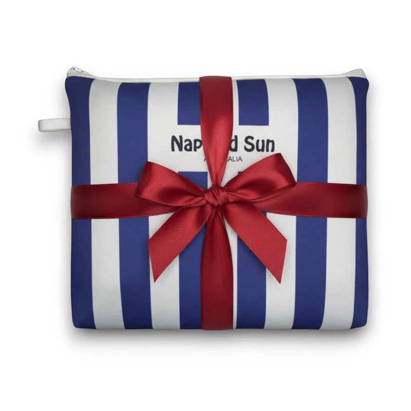 blue white striped beach pouch wrapped in a red ribbon
