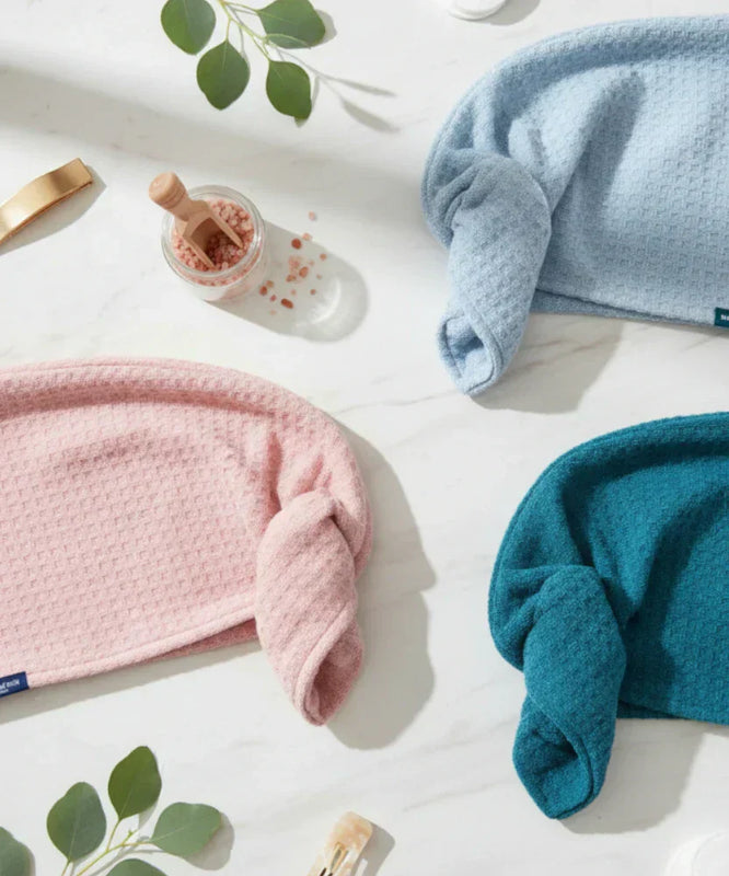 Pastel colour hair wraps neatly organised on a counter