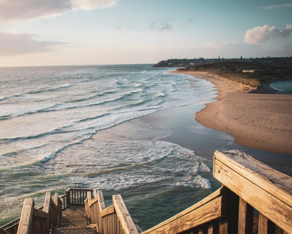 wooden stairs down to the ocean