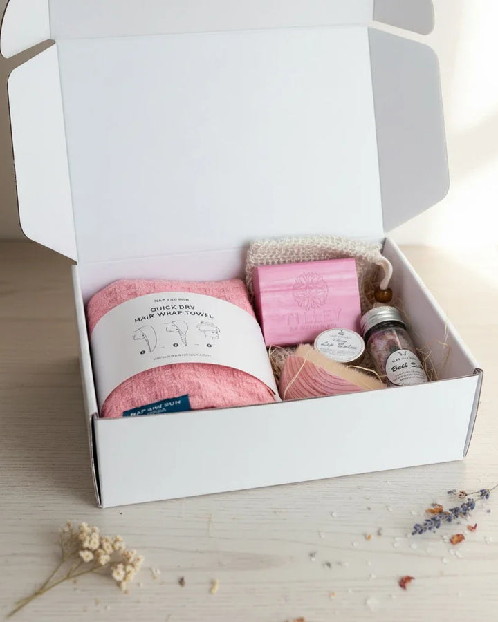 Gift box with wellness essensials, hair wraps, bath salt.