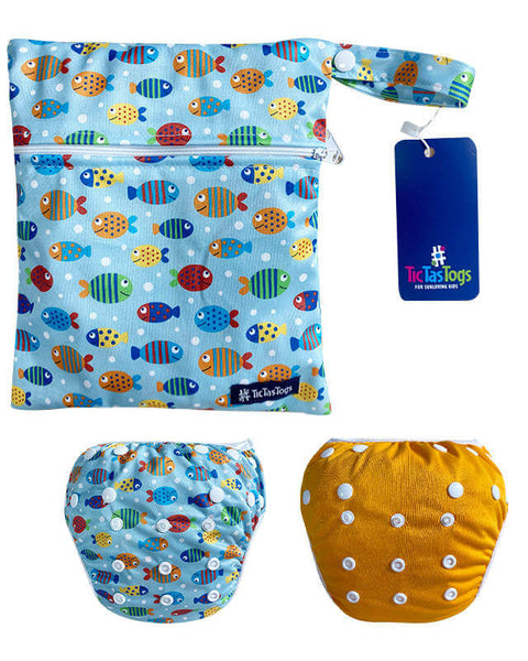 Baby swim diaper bag with fish pattern and yellow swim nappies on a white background