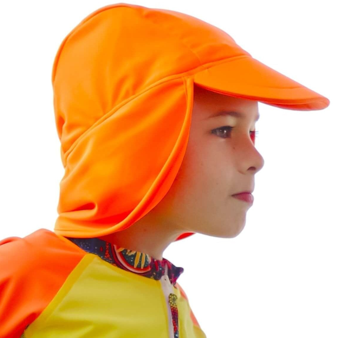 Child wearing an orange sun hat with a white background