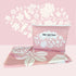 Nap and Sun Pink Bloom sand-free beach towel featuring a double sided design. Front: soft pink background with white floral pattern. Back: White background pink geometric lines. free matching wetbag included. 