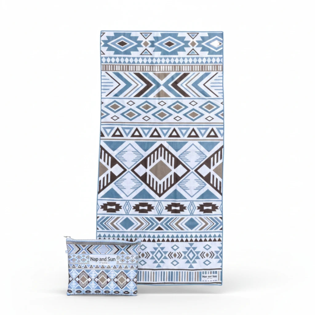 blue, white geometric pattern beach towel with bag on white background