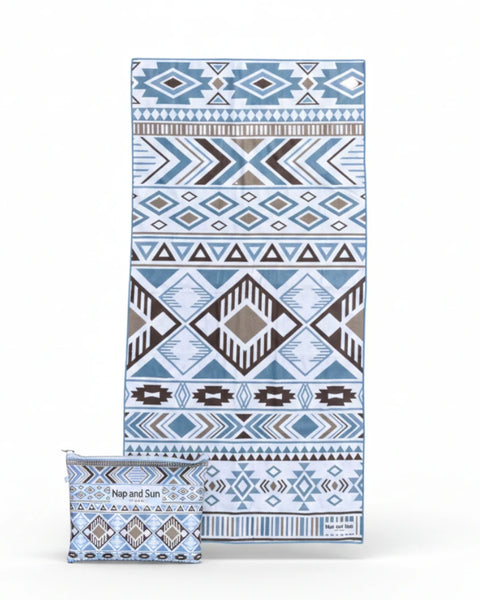 blue, white geometric pattern beach towel with bag on white background