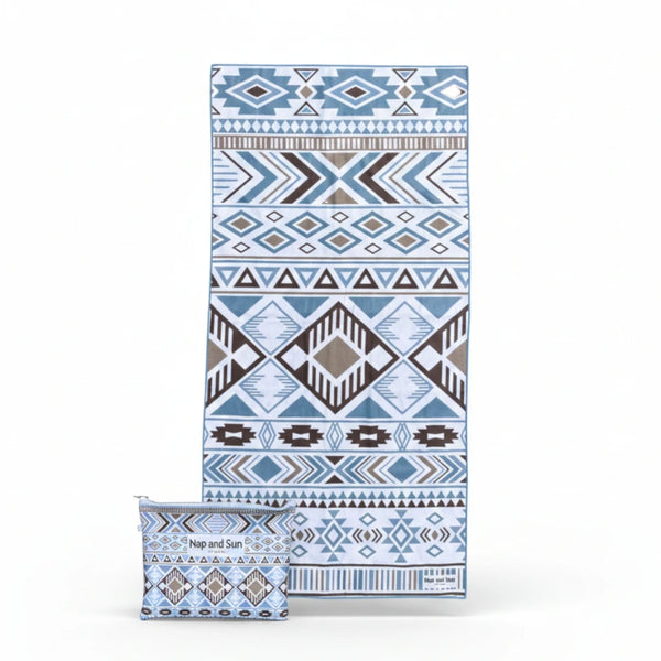 blue, white geometric pattern beach towel with bag on white background