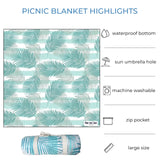 Light green palm leaves patterned picnic blanket displayed fully stretched out and rolled up. Text overlay highlights features: waterproof bottom, sun umbrella hole, machine washable, zip pocket, large size.