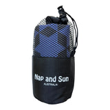 Indigo colour gym towel with black star pattern called Power stored in a black mesh bag with the Nap and Sun Australia logo on the bag.