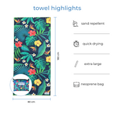 Full-size Nap and Sun Tropical style towel displayed with matching neoprene wetbag. Text overlay highlights features: sand repellent, quick drying, extra large, neoprene bag.
