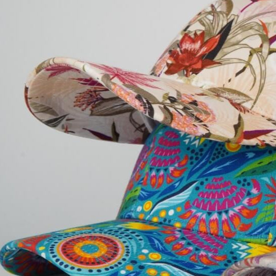 Colorful floral-patterned chair with a vibrant design on a plain background