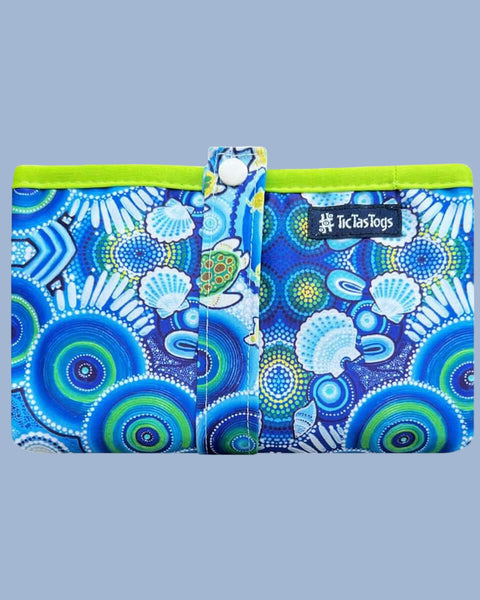 Two blue and green patterned bags with a visible brand logo on a light gray background