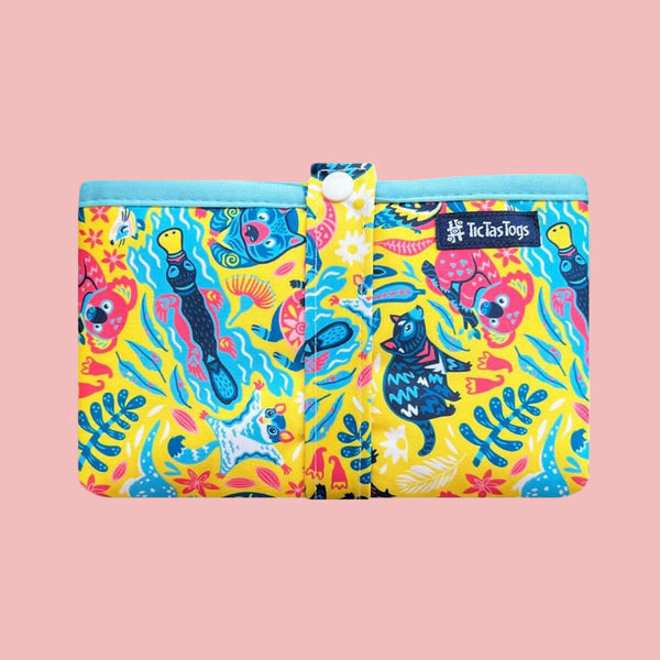 Colorful pouch with animal pattern on a pink background