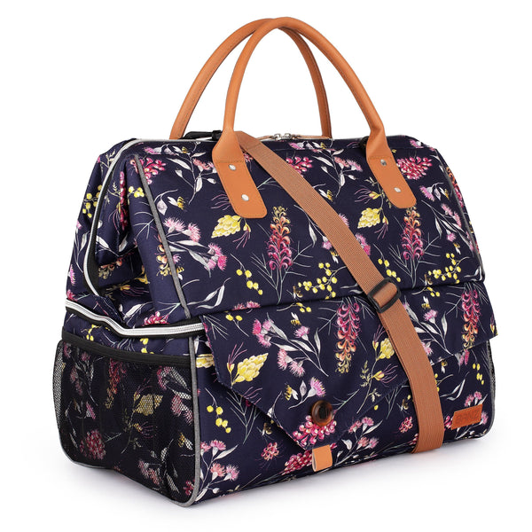 Floral-patterned bag with brown handles and strap on a white background