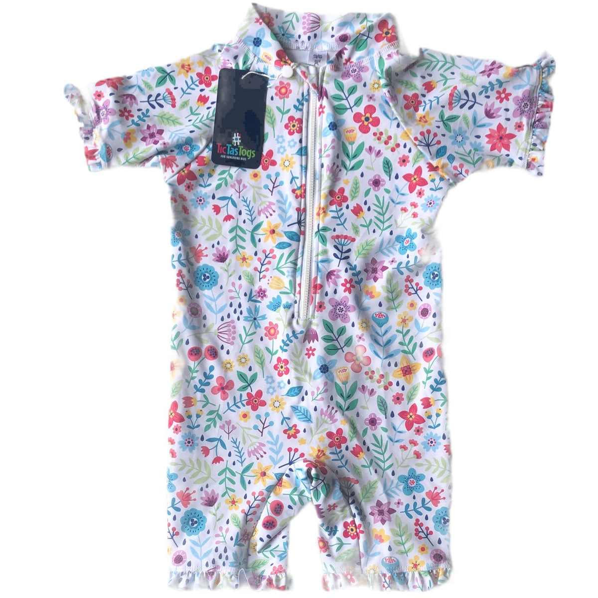 Floral-patterned baby swimsuit with a visible brand tag on a white background
