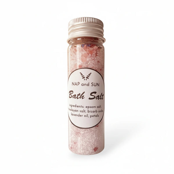 Bottle of bath salts with a label on a white background