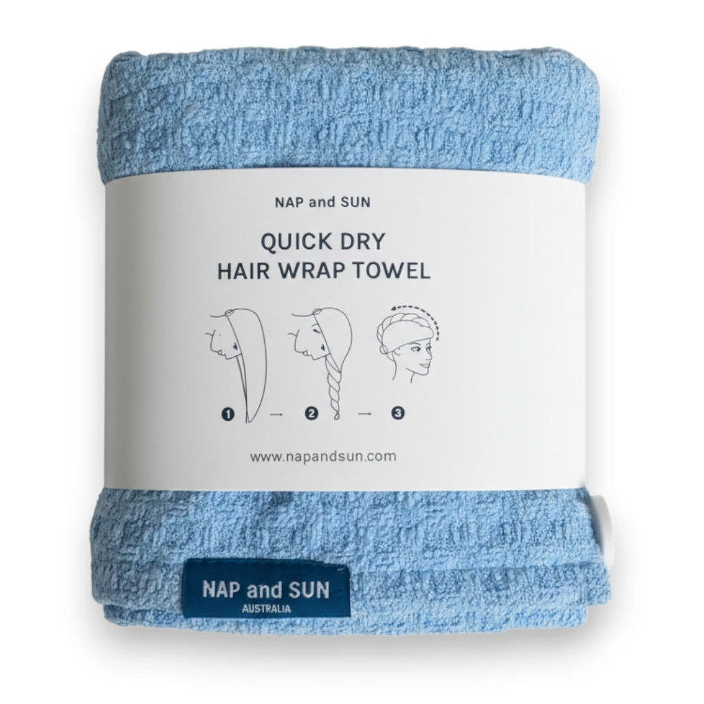 Blue hair wrap towel wrapped in a paper sleeve