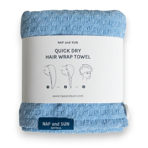 Blue hair wrap towel wrapped in a paper sleeve