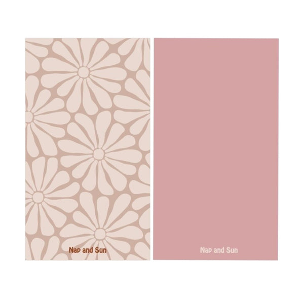 Nude colour gym towel with light nude hippy-style flower pattern, solid pink color on the back.