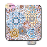 Mandala patterned picnic blanket on a white background with umbrella hole