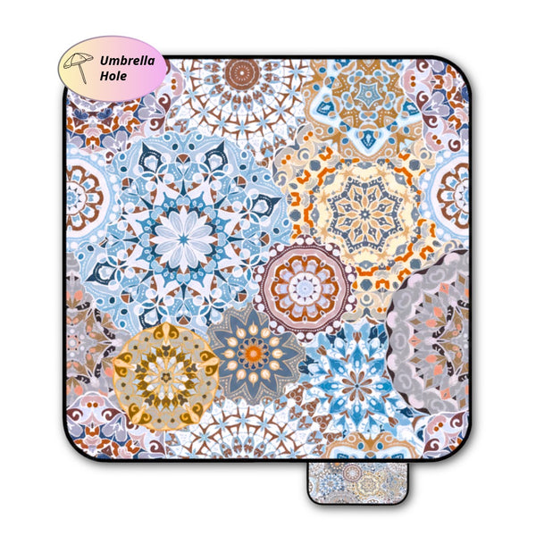 Mandala patterned picnic blanket on a white background with umbrella hole