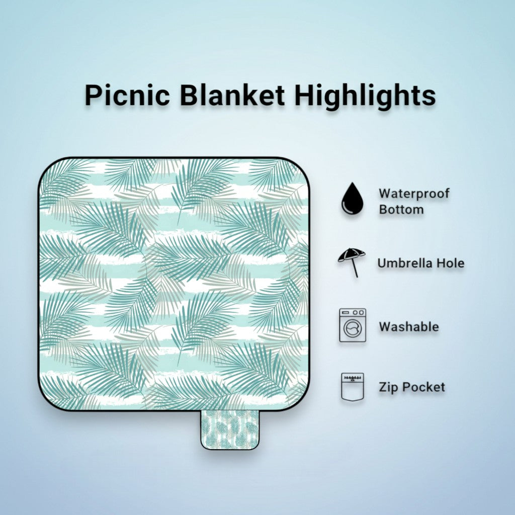 palm leaf patterned picnic blanket features listed on a light blue background