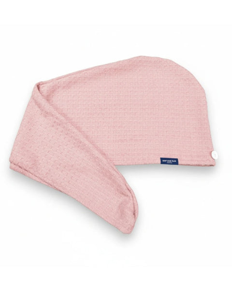 Pink textured hair wrap towel on a white background