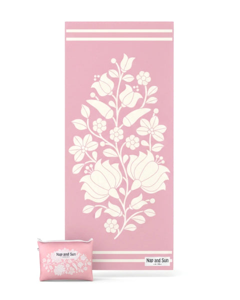 PInk floral patterned beach towel with pouch on a white background