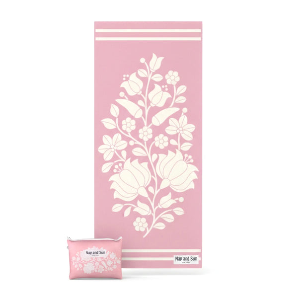 PInk floral patterned beach towel with pouch on a white background