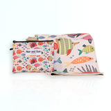 Nap and Sun Rainbow Reef sand-free beach towel for kids with a colorful underwater theme on the front, featuring vibrant coral, fish, and sea creatures on a light peachy background. Free matching wetbag included. 