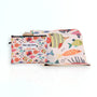 Nap and Sun Rainbow Reef sand-free beach towel for kids with a colorful underwater theme on the front, featuring vibrant coral, fish, and sea creatures on a light peachy background. Free matching wetbag included. 
