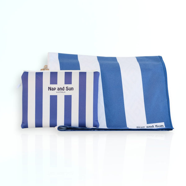 Nap and Sun Stripe Love sand-free beach towel featuring a bold, alternating navy blue and white horizontal stripes. Free matching wetbag included.