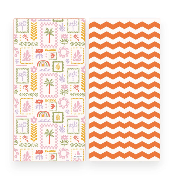 Two sides of a beach towel shown side by side on a white background. The left side has a pastel tropical and boho pattern with palm trees, flowers, rainbows, and geometric frames on a white base. Right side has a zig-zag horizontal lines in orange colour.