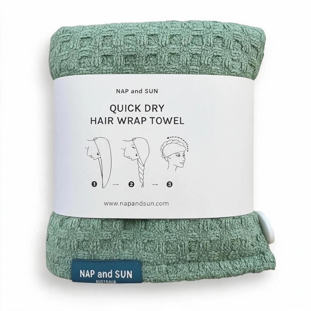 A mint green textured quick-dry hair wrap towel from NAP and SUN, wrapped in a white paper band with product details and a small navy brand tab at the bottom.